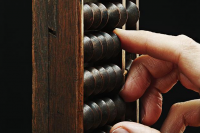 Hand on abacus