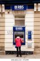 Woman getting cash from an RBS ...