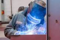A welder welding at P.P. ...