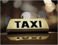 ... Taxi sign lit up at night