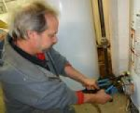 A plumber tightening the