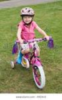 Girl aged four wearing cycle