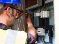 Close-up of electrician using ...