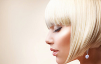 Model with a short white bob