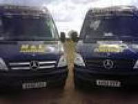 Two M & L Plasterers vehicles ...