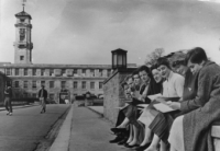 Students sitting on the wall