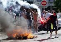 Up in flames: Striking taxi ...