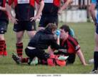 physio checking injured player ...